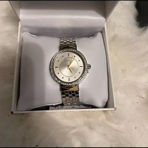 Jessica Simpson silver tone with gold tone accents. New in box